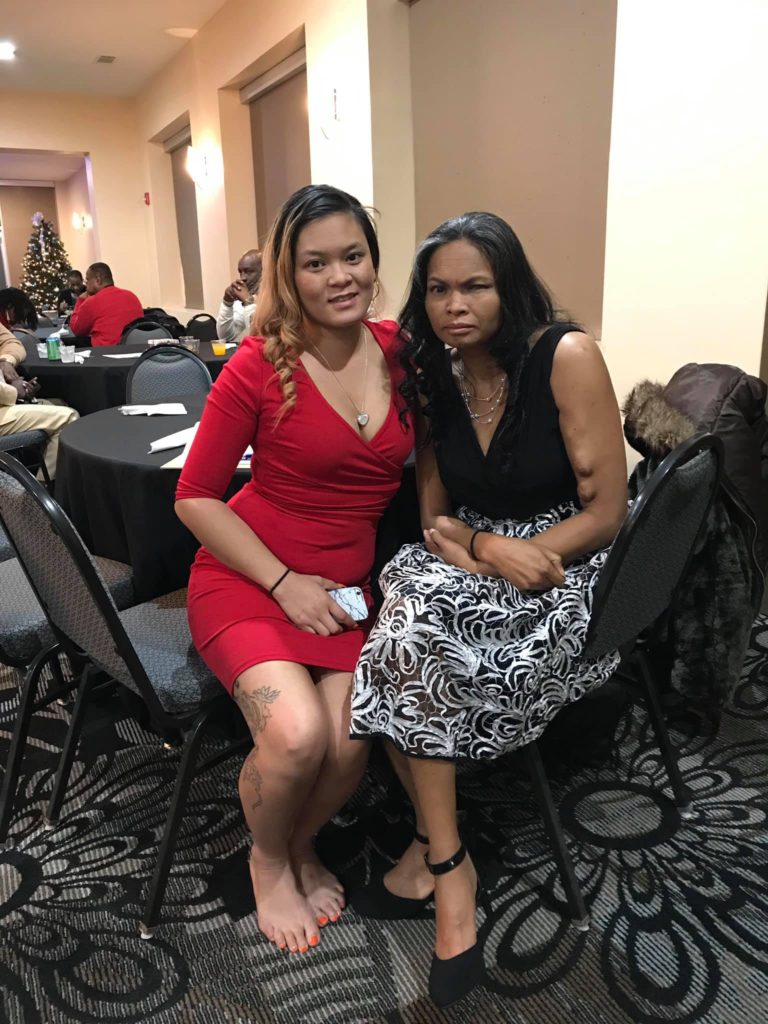 Two people, dressed formally, sitting, White Cane Christmas Party 2018